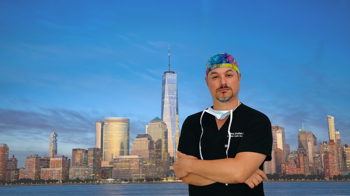 Dr. Matthew Schulman standing in front of New York City skyline